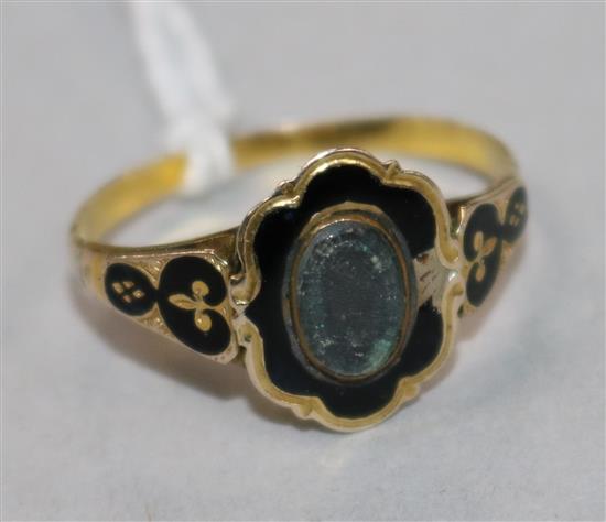 A 19th century gold and black enamel mourning ring, size Q.